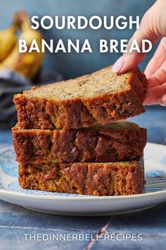 two slices of sourdough banana bread on a plate with bananas in the background