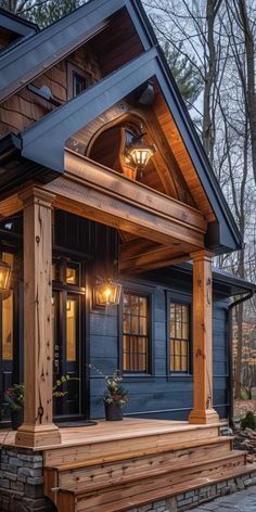 the front porch is covered in wood and has two lights on it, as well as a