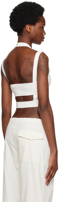 Rib knit stretch nylon-blend tank top. Cut out detailing throughout. · Layered construction · Halter strap Supplier color: Ivory Chic White Crop Top With Tank Straps, Chic White Tank Top With Straps, White Chic Crop Top With Seamless Construction, Chic Crop Top With Seamless Construction And Tank Straps, Chic White Crop Top With Seamless Construction, Chic Seamless Crop Top With Tank Straps, Chic White Seamless Crop Top, Chic White Tank Top With Seamless Construction, Chic White Seamless Tank Top