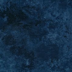 a dark blue textured wallpaper with black spots on the top and bottom half