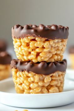 three pieces of chocolate covered macaroni and cheese on a plate