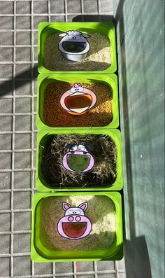 three plastic containers filled with food sitting on top of a cement floor next to a metal grate