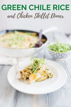 a white plate topped with an omelet next to a bowl filled with salad