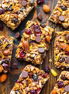 granola bars with chocolate chips and nuts on a wooden table, ready to be eaten