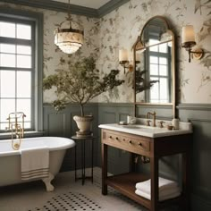 a bath room with a tub a sink and a mirror