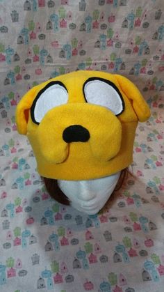 Adventure Time Jake the Dog Inspired Fleece Hat Handmade Themed Cosplay Hat, One Size Fits Most, Themed Hats For Cosplay, One Size Fits Most, Themed Cosplay Hat, Fun Halloween Cosplay Hat, Adjustable Beanie Hat For Cosplay, Adjustable Beanie For Cosplay, Novelty Beanie For Cosplay, Halloween Cosplay Beanie Hat, Fun Winter Costume Accessories For Costume Party