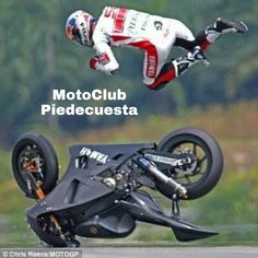 a person on a motorcycle doing a trick in the air