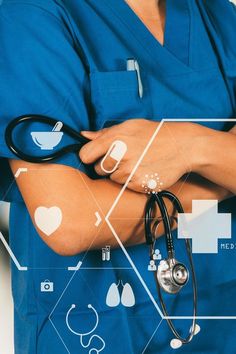 a person in scrubs with their arms crossed and medical symbols on the screen behind them