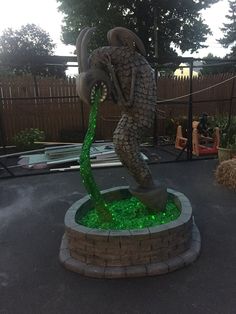 a statue is shown with green water in it