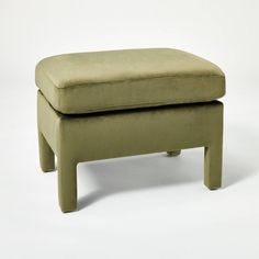 a small foot stool sitting on top of a white floor