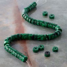 "Find the Green Reconstituted Stone Heishi Beads by Bead Landing™ at Michaels. These pretty green heishi beads made to look like malachite will add eye-catching appeal to your accessory creations. On their own or mixed with complementary beads and charms, these beads will make lovely necklaces, bracelets and earrings. These pretty green heishi beads made to look like malachite will add eye-catching appeal to your accessory creations. On their own or mixed with complementary beads and charms, the Bead Landing, Pretty Green, Heishi Beads, Lovely Necklace, Green Bead, How To Make Beads, Necklaces Bracelets, Natural Stones, To Look