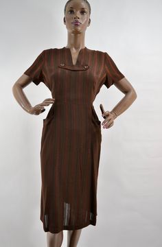 "50's super soft woven dress. Rich brown, with brick red striped pattern. In between stripes are woven alternating stiching to create a checkerboard pattern with negative space, and a little peek-a-boo to the skin. Darling button collar and outside front pockets Slight fading under armpits. In excellent used condition. No belt. 15\" shoulders 12\" sleeve 40\" chest 30\" waist 40\" hips 42\" length" Vintage Brown Midi Length Dress, Vintage Striped Workwear Dresses, Vintage Brown Lined Dress, Vintage Striped Dress For Work, Vintage Striped Dresses For Work, Retro Brown Lined Dress, Vintage Brown Knee-length Dress, Retro Brown Midi Dress, Vintage Brown Short Sleeve Dress