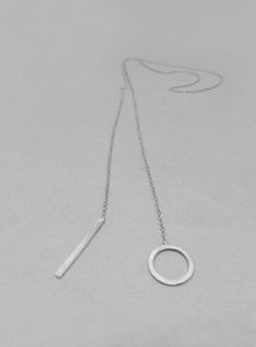 This Lariat necklace is totally handmade made from sterling silver. A dainty necklace that adjusts to any outfit. Great layering charm necklace, easy to wear on its own too. The diameter of the circle is 12 mm and the bar is 20 mm long. Length: 52 cm -----> 20 inches 62 cm -----> 24 inches 72 cm -----> 28 inches Feel free to ask for a different length. The necklace above is not the exact one you will receive. Each one is handmade to order and may slightly vary from the pictures. Please Circle Bar, Eternity Necklace, Stacked Necklaces, Silver Chain Style, Mismatched Earrings, Heart Studs, Lariat Necklace, Minimalist Necklace, Necklace Sterling Silver