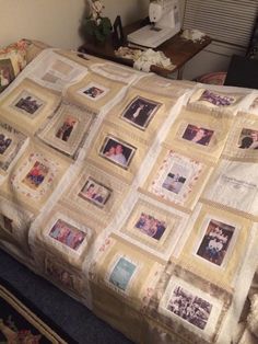 a bed with a quilt on top of it