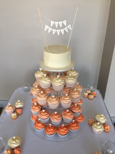 a cake and cupcakes on a table