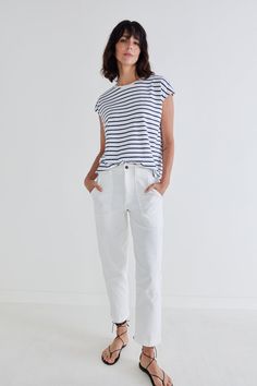 A perfect tee to style all-year long. Its ribbed fabric and striped pattern are timeless and so comfortable. Tuck it in the front just a little for an easy, flattering look. Relaxed fit Ribbed fabric Round neck Short sleeves Meant to be tucked in the front (but you can wear it as is too!) Chic Pants, Oversized Tunic, Denim Details, Fashion Help, White Pants, Navy Stripes, Ribbed Fabric, Denim Fabric, Personal Stylist