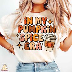 a woman wearing a shirt that says in my pumpkin spice era