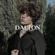 a man standing in front of bushes with his hands on his hips and the words dalton above him