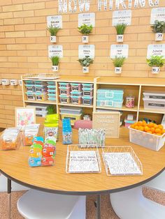 there is a table that has some boxes on it and other items in front of it