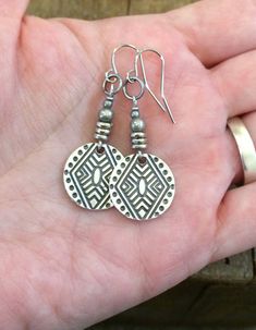 "Geometric, boho small silver dangle earrings with tribal etched pattern. Small, light weight boho, tribal inspired silver dangle earrings. Perfect for everyday wear and will add a little boho, southwestern vibe to your favorite outfit. Product overview: - Made with silver plated pewter drops and antiqued silver accents - Total hanging length of 1.75\" - Light weight and versatile, perfect for everyday wear - Hypoallergenic ear wiresPlease sign up for the Rustica Jewelry newsletter to receive sp Jewelry Newsletter, Small Boho, Etsy Earrings Dangle, Earrings Boho, Small Light, Geometric Earrings, Silver Earrings Dangle, Silver Accents, Gorgeous Necklaces