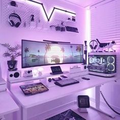 a white desk topped with a computer monitor and keyboard