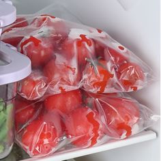 tomatoes and cucumbers are wrapped in plastic to keep them fresh from the freezer