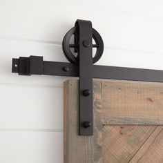 a close up of a door handle on a barn door