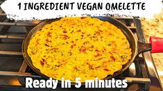 an omelette sitting on top of a stove with the words, 1 ingredient vegan omelete ready in 5 minutes