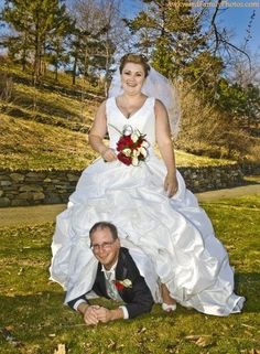 a bride and groom posing for a photo on their wedding day