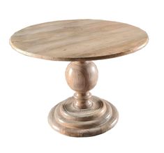 a round wooden table sitting on top of a white floor