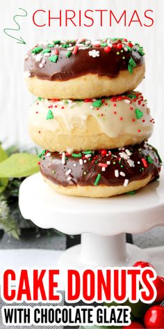 three christmas donuts with chocolate glaze and sprinkles