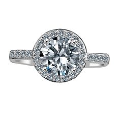 a diamond engagement ring with pave set diamonds on the band and an oval center stone