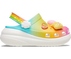 Feeling like walking on sunshine? The new Care Bears Crush Clog delivers a rainbow of comfort and style. This limited-edition silhouette features a printed colorful gradient on the upper, complemented with soft plush Jibbitz™ charms. The unique rainbow and cloud heel strap pivots for added stability and comfort wherever your daydreams take you.
Care Bears Crush Clog Details:

Bold styling and added height 
6 exclusive plush Jibbitz™ charms 
Colorful gradient printed design 
Unique rainbow ankle strap 
Unique 2-inch / 5.2cm height, measured from floor to heel rest 
Customizable with Jibbitz™ charms 
Iconic Crocs Comfort™: Lightweight. Flexible. 360-degree comfort. Care Bears Shoes, Care Bear Clothes, Care Bears Clothes, Crocs Limited Edition, Care Bears Merchandise, Work Sandals, Dolls Kill Care Bears, Crocs Men, Colorful Gradient