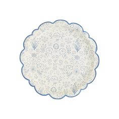 a white plate with blue trim and flowers on the rim, against a white background