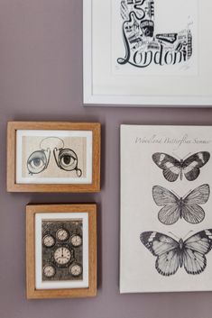 three framed pictures hang on the wall next to each other, one with an eye and two with butterflies