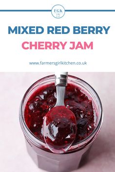 a jar filled with red berry jam on top of a pink tablecloth and text overlay reads mixed red berry cherry jam