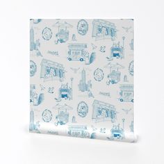 a blue and white wrapping paper with pictures of different things on it, including a train