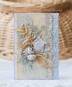 a close up of a card on a table with a basket in the back ground