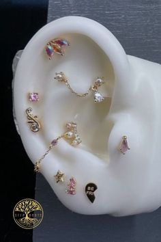 the ear is decorated with different colored jewels