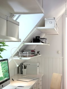 a computer monitor sitting on top of a white desk