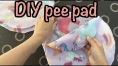 someone is making a diy pee pad out of fabric