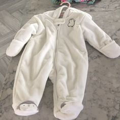 Never Worn Super Warm Snow Suit Cute White Onesie For Winter, Cute White Winter Onesie, White Winter Outerwear For Playwear, White Fitted Winter Onesie, White Long Sleeve Onesie For Playwear, White Long Sleeve Romper For Playwear, White Winter Playwear For Babies, White Long Sleeve Playwear For Babies, White Faux Fur Vest