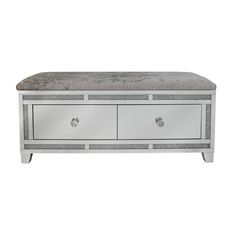 a silver bench with two drawers on top and one drawer open to show the bottom