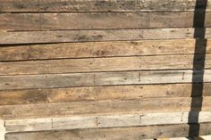 the side of a wooden building with planks