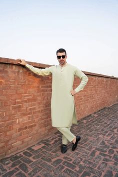 Color: Pistachio Green Fabric: Organic Cotton  Includes:  -Kurta -Trouser -Kurta Trouser:  Breathable Soft Cotton with good fall.  -Mandarin collar  -Full Sleeves  -This is a 2 Piece Stitched Outfit Customize Stitching Available Fitted Pista Green Lawn Suit With Dabka Details, Fitted Pista Green Lawn Suit With Dabka, Fitted Long Sleeve Green Lawn Suit, Fitted Long Sleeve Pista Green Lawn Suit, Casual Green Kurta For Eid, Green Casual Kurta For Eid, Men Kurta, Designer Suit, Style Formal