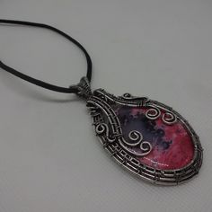 Artistic "Rhodochrosite" Handmade Wire-Wrapped Silver Pendant On A 18" Black Leather #850 All Of My Jewelry Is Handmade By Me In My Smoke & Pet Free Home!!!!!! Please Note That Every Item Purchased Comes In A Drawstring Organza Bag For Easy Gift Giving!!! Please Note That I Will Consider Any Reasonable Offer On My Jewelry!!!!!!!!!! Please Let Me Know If You Have Any Further Questions. Thanks For Stopping By And Have A Terrific Day!!!! Pink Wearable Art Jewelry As Gift, Pink Wearable Art Jewelry For Gift, Handmade Artisan Pink Necklaces, Handmade Artisan Pink Jewelry, Handmade Pink Artisan Jewelry, Handmade Pink Jewelry In Wearable Art Style, Artistic Pink Necklace For Gift, Handmade Pink Wearable Art Jewelry, Pink Handmade Wearable Art Jewelry