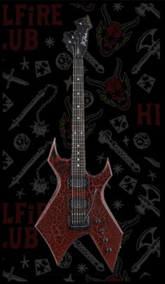 an electric guitar with skulls on it and the words life u b h in red