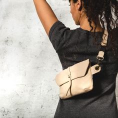 This Beige Leather Fanny Pack is the ideal bag if you like carrying all your necessities, keep your hands free and look effortlessly fashionable at the same time!Perfect for festivals, markets and travelling.Simple and beautiful bag made of a high quality Italian  leather, which is soft to touch, strong, durable and a very fine material.Top grade thicker leather is used for the adjustable belt.This hip bag features one separate compartment closed by a zipper in the back and another zippered pock Beige Crossbody Belt Bag For On-the-go, Versatile Satchel Belt Bag For Daily Use, Everyday Chest Bag With Adjustable Strap, Beige Mobile Phone Belt Bag In Shoulder Style, Adjustable Strap Chest Pouch For Everyday Use, Beige Pouch Chest Bag With Adjustable Strap, Chic Pouch Belt Bag For Daily Use, Beige Satchel Belt Bag With Adjustable Strap, Casual Clutch With Adjustable Strap For Travel