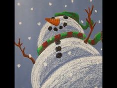 a drawing of a snowman with a green hat and scarf on it's head