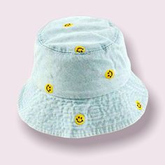 Adjustable denim hat. Blue Cotton Bucket Hat With Flat Brim, Casual Adjustable Light Blue Sun Hat, Adjustable Light Blue Casual Sun Hat, Casual Smiley Face Hat With Curved Brim, Denim Blue Curved Brim Hat, Adjustable Cotton Hat With Smiley Face, Fun Blue Bucket Hat, Curved Brim Denim Blue Hat, Trendy Blue Flat Brim Bucket Hat